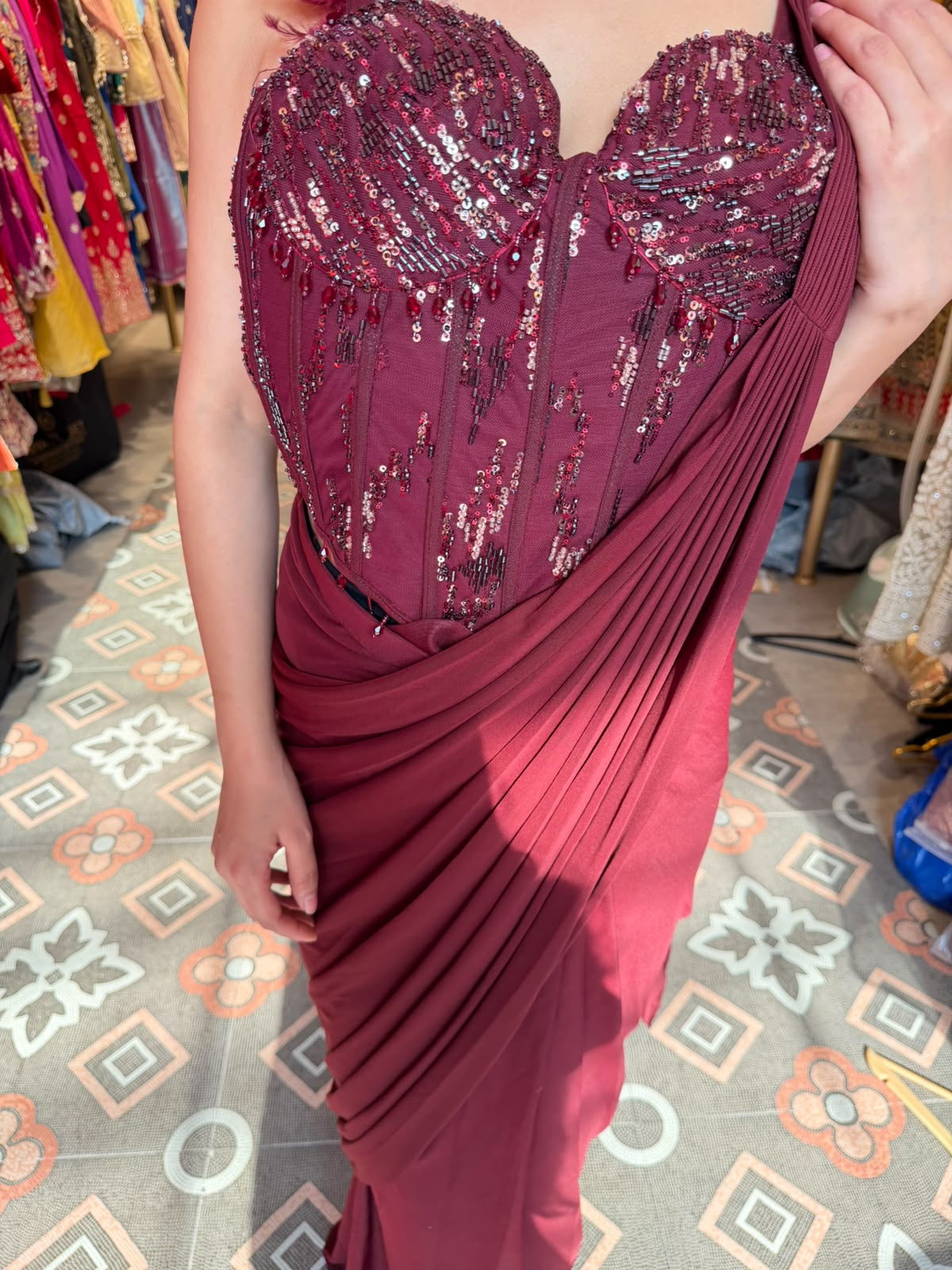 Glamorous Wine Draped Saree Gown with Embellished Corset Blouse