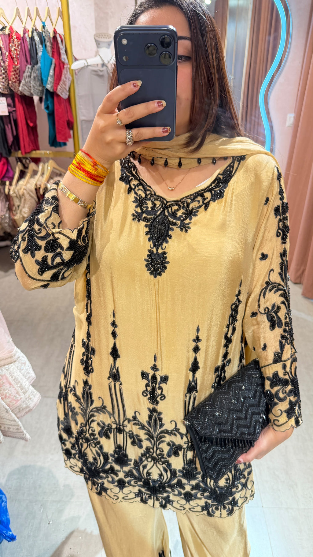 Pakistani-style heavy embroidered georgette palazzo suit set.