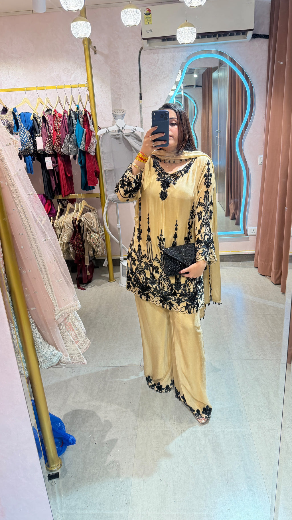 Pakistani-style heavy embroidered georgette palazzo suit set.