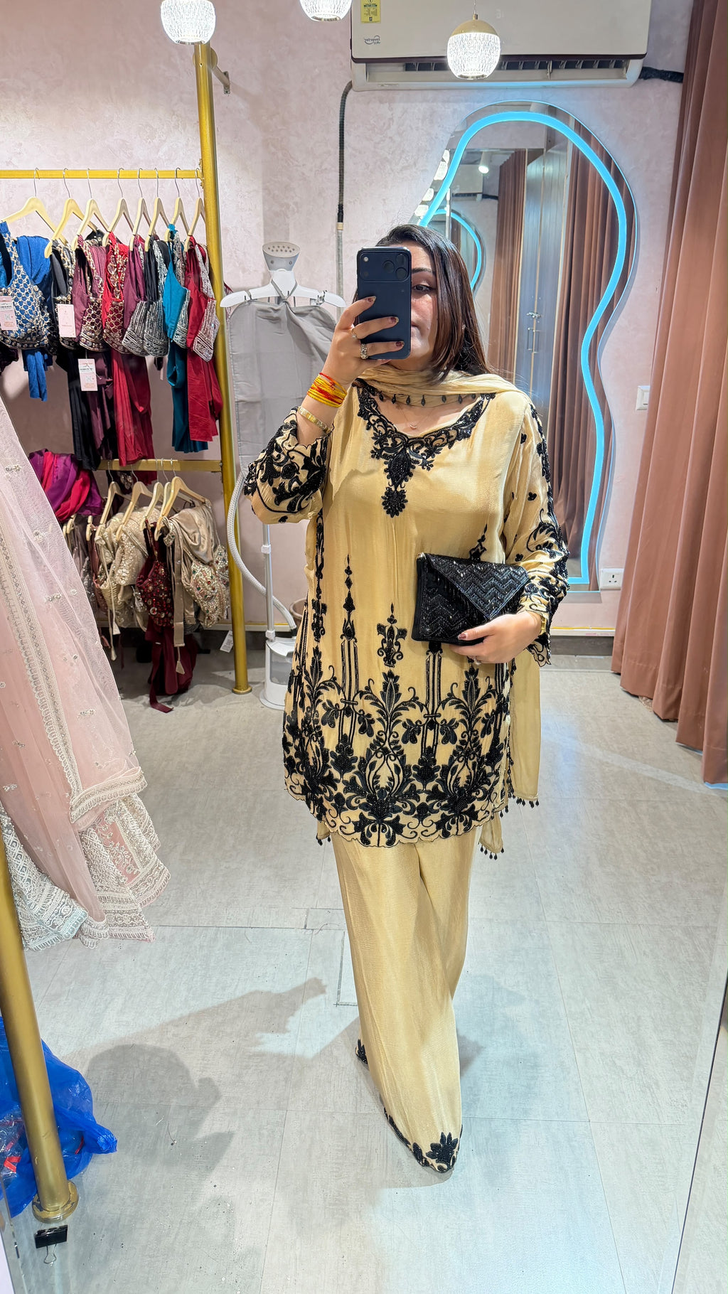 Pakistani-style heavy embroidered georgette palazzo suit set.