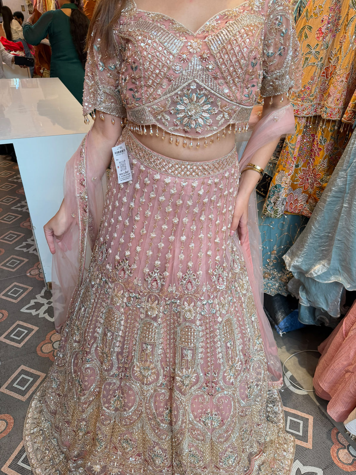 Blush Pink heavily embellished flared lehenga and matching blouse.