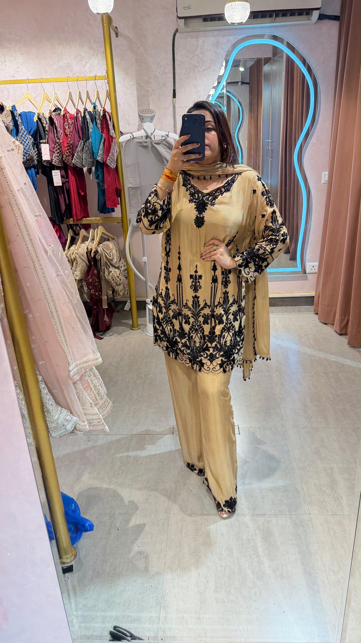 Pakistani-style heavy embroidered georgette palazzo suit set.