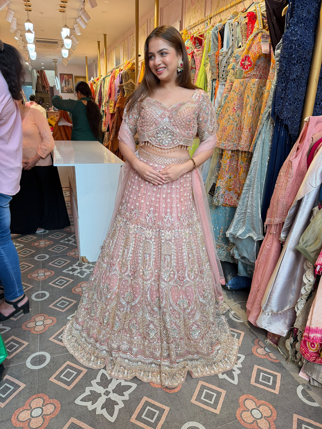 Blush Pink heavily embellished flared lehenga and matching blouse.