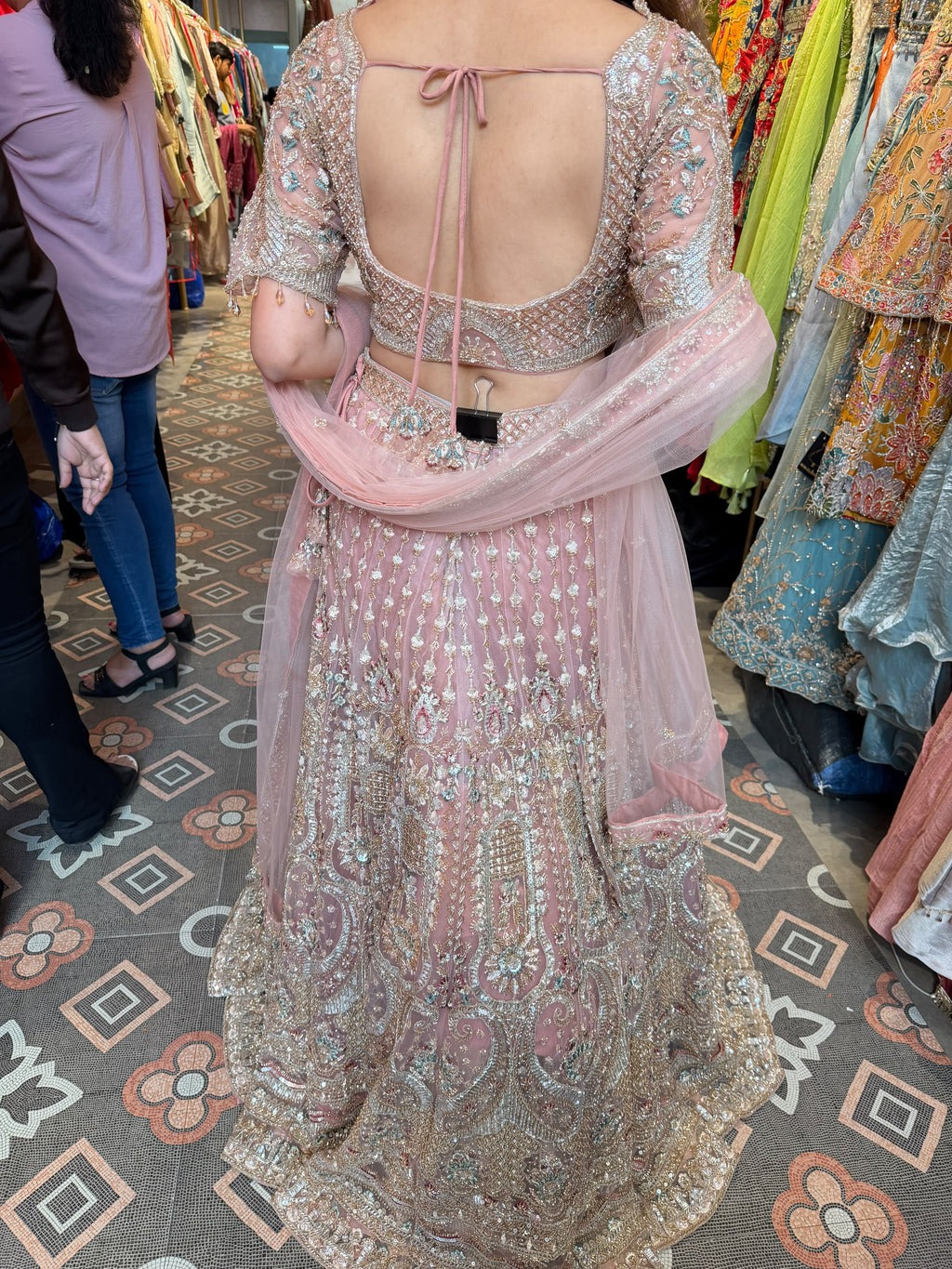 Blush Pink heavily embellished flared lehenga and matching blouse.