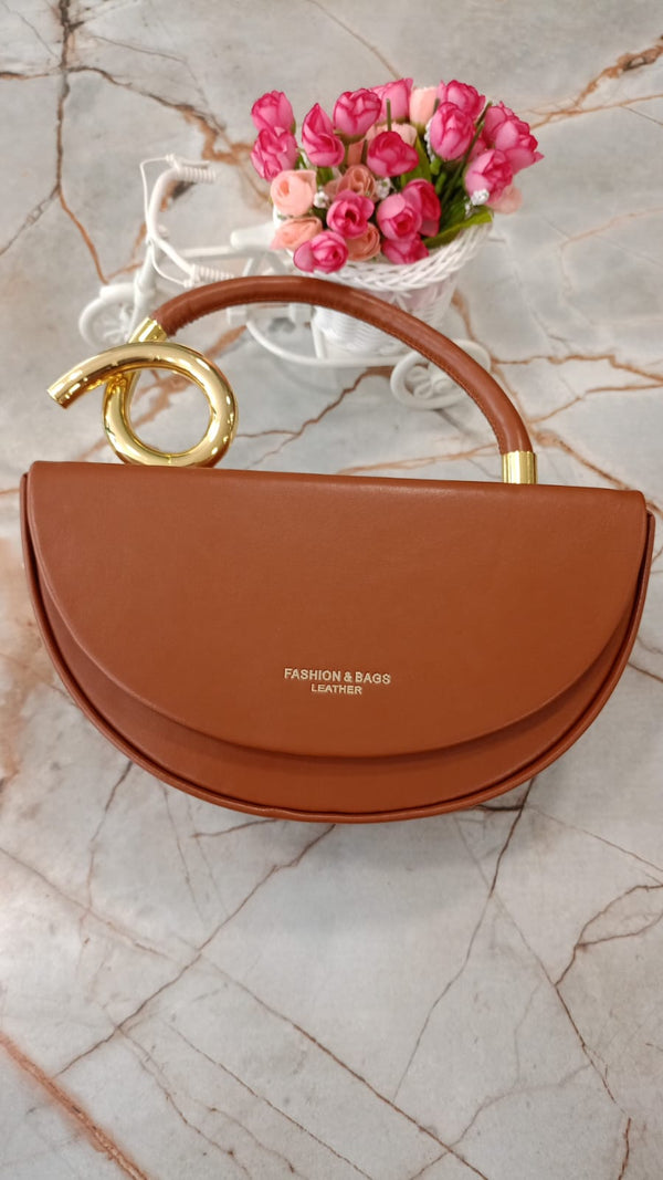 Leather handbag with a unique handle