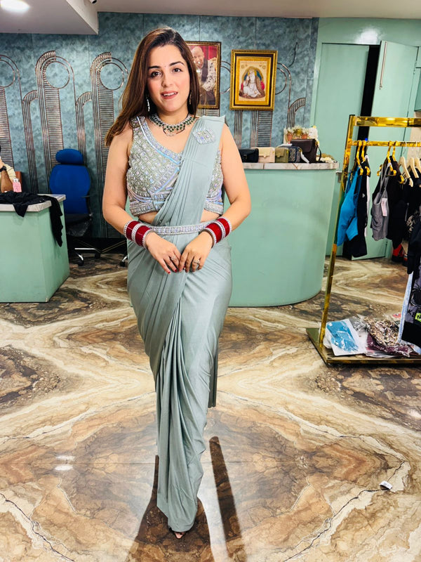 Saree with a heavily embellished blouse with belt