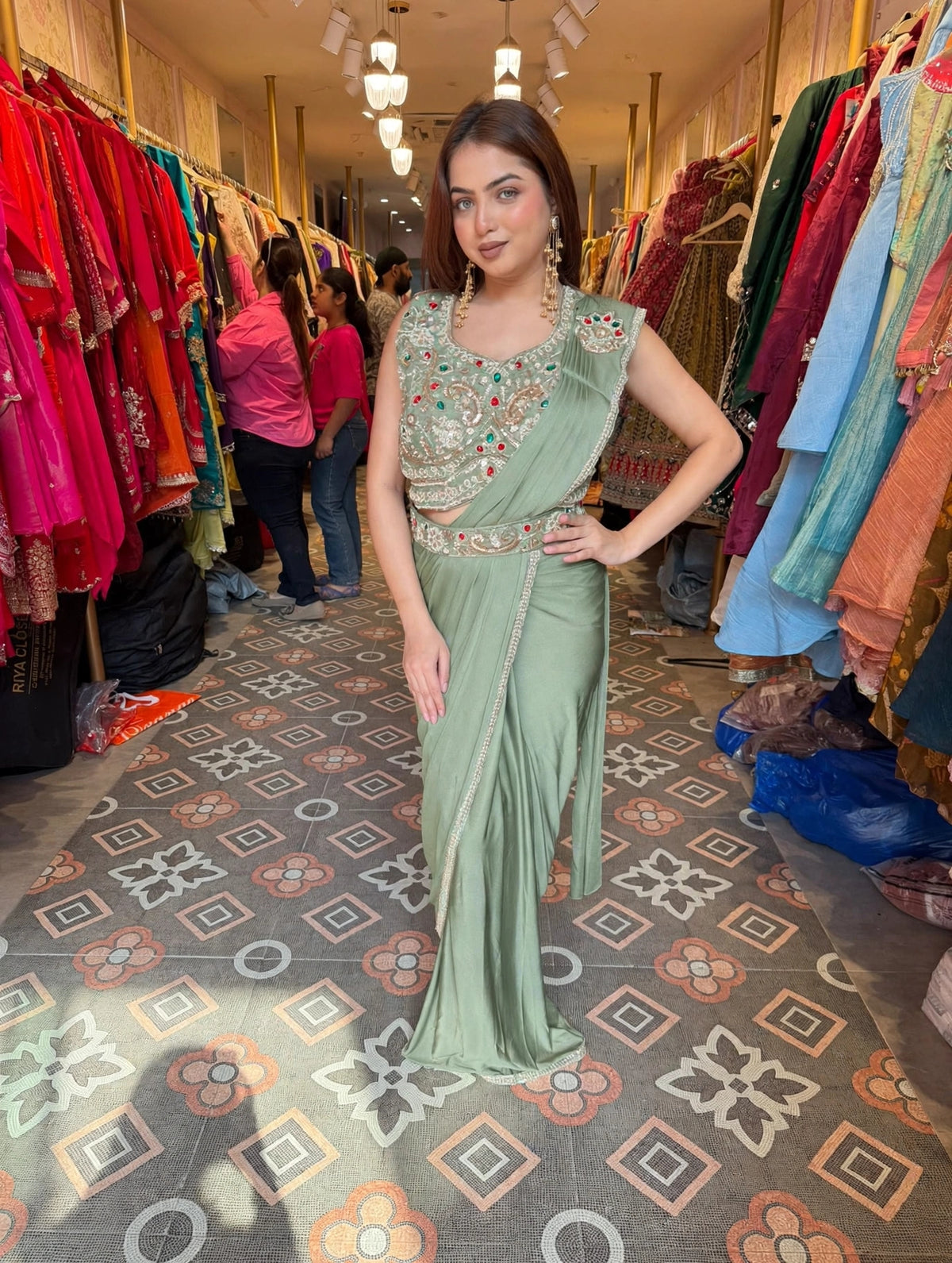 Pastel Pink Pre-Draped Saree with Embellished Sleeveless Blouse